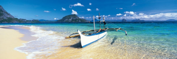 Outrigged Canoe On The Beach